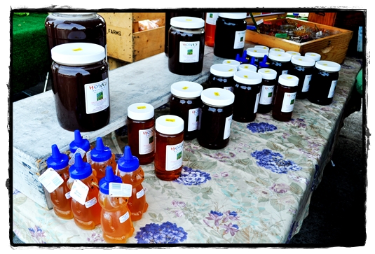 raw honey table at the farmer's market