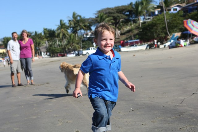 toddler running on beach
